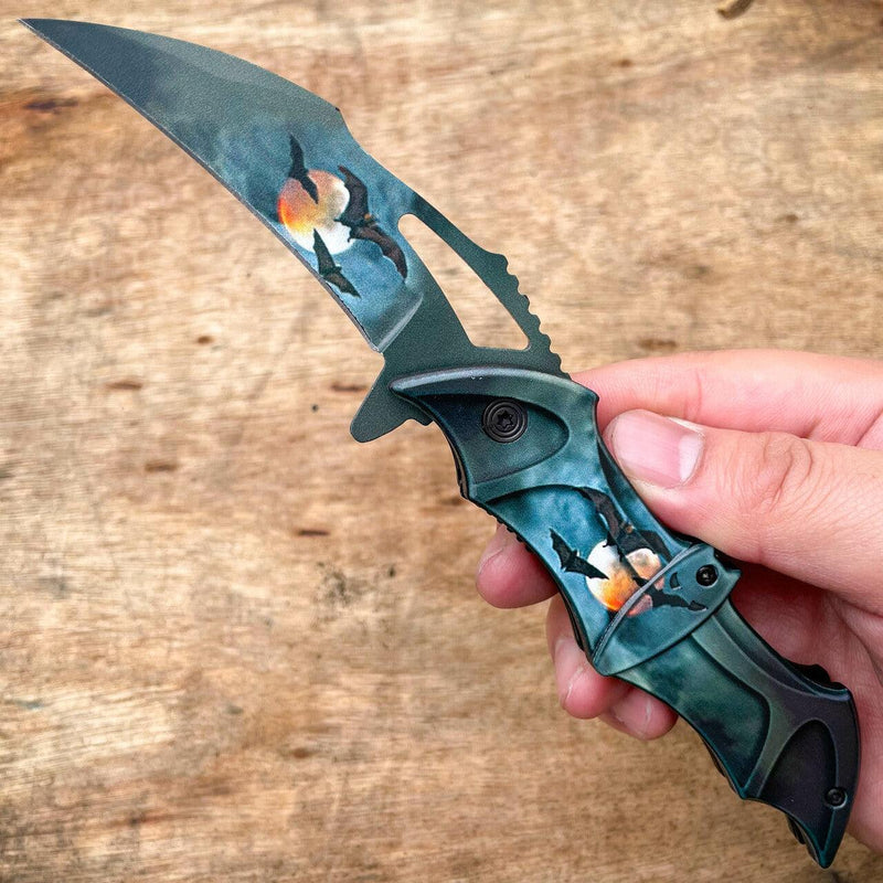 https://megaknife-wholesale.com/cdn/shop/products/blade-addict-knives-8-fantasy-bat-spring-assisted-open-folding-pocket-knife-dark-knight-joker-blade-36349547872470_800x.jpg?v=1668121711